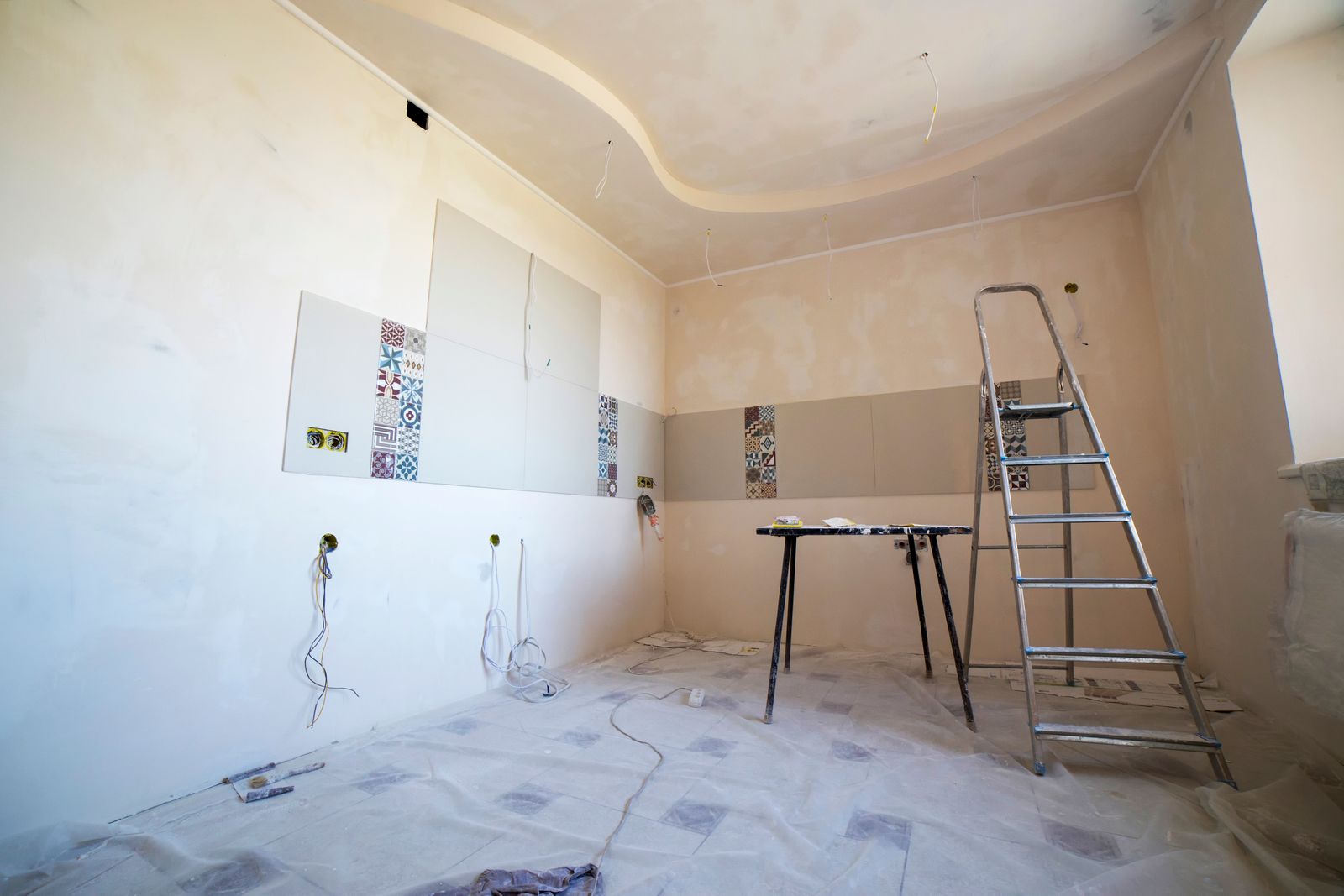 The same room later in the works, surfaces prepared and equipment staged.