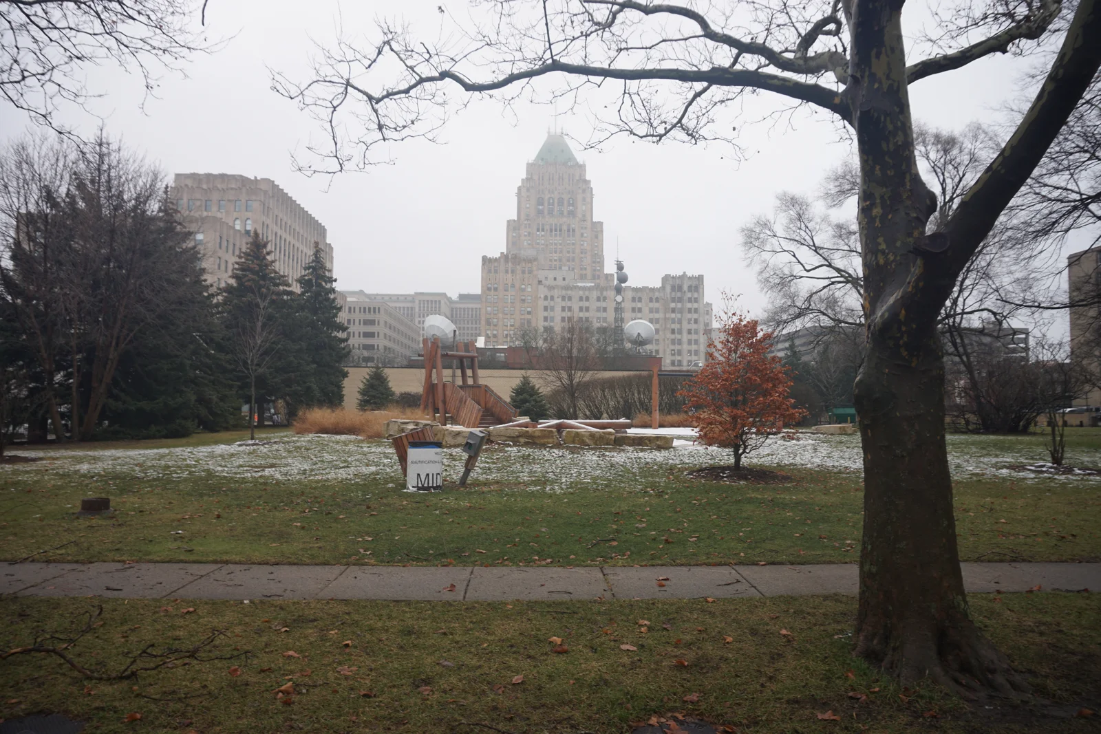A winter view through Pallister Park toward the Fisher Building.