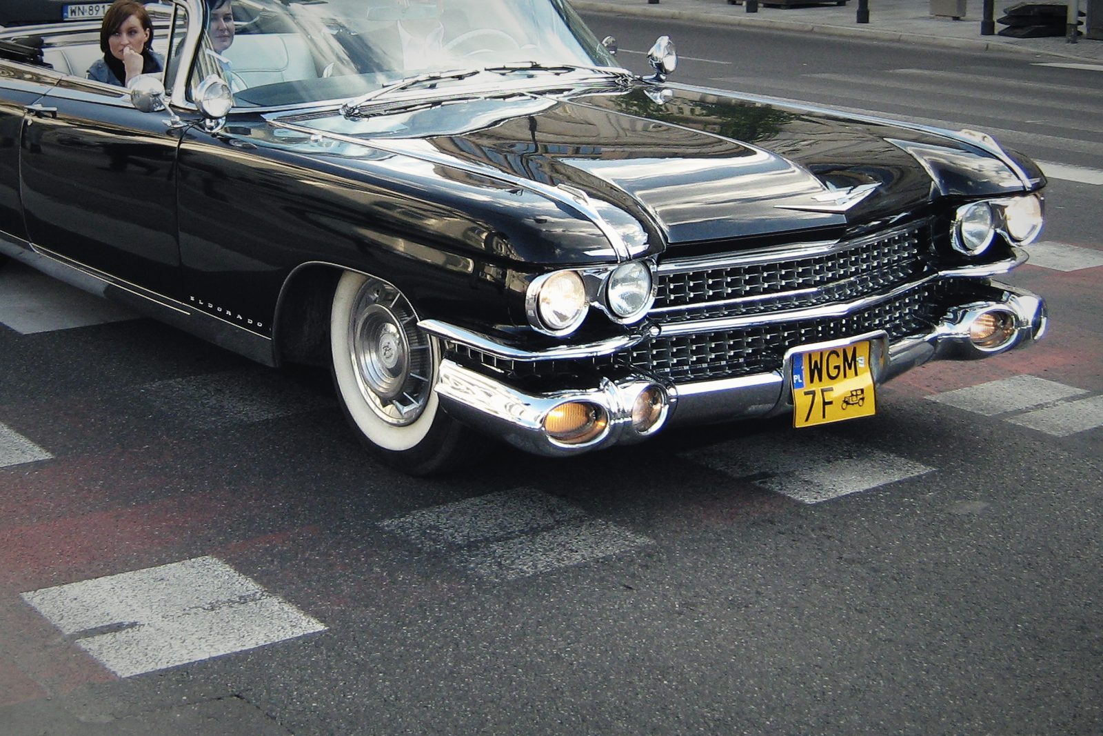 A black 1959 Cadillac Eldorado Biarritz convertible photographed on a city street.