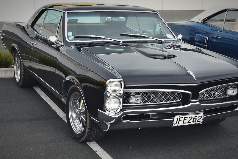 A black 1967 Pontiac GTO photographed from the front three-quarter.