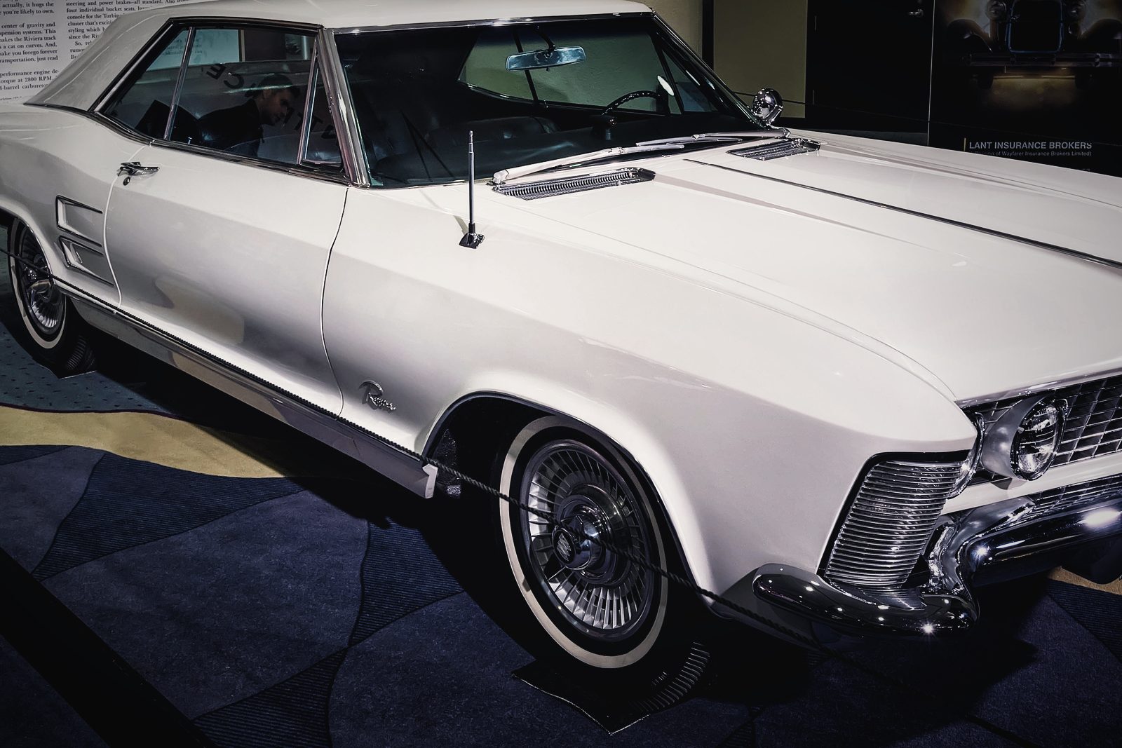 A white 1963 Buick Riviera photographed from the front three-quarter.